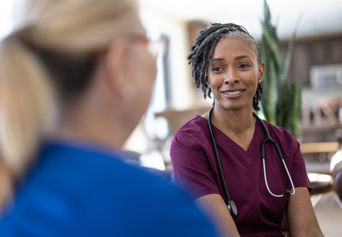 Portrait of a pair of travel nurses talking and smiling